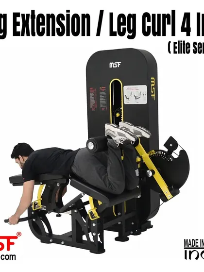 A user at the peak of the prone leg curl movement, targeting the hamstrings.