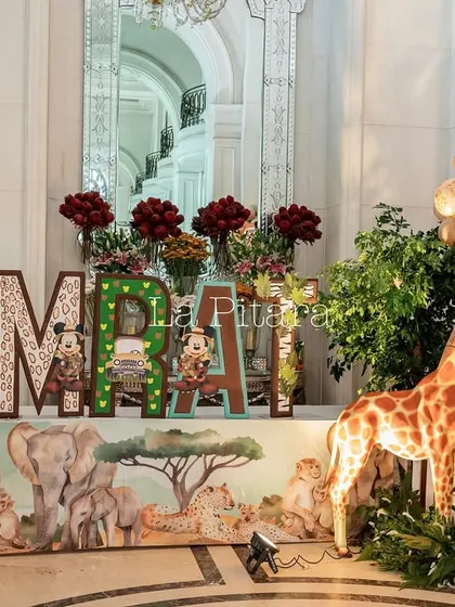 Large, custom-decorated letters spelling out the birthday boy's name, 'SAMRAT', each with a unique jungle-themed design.