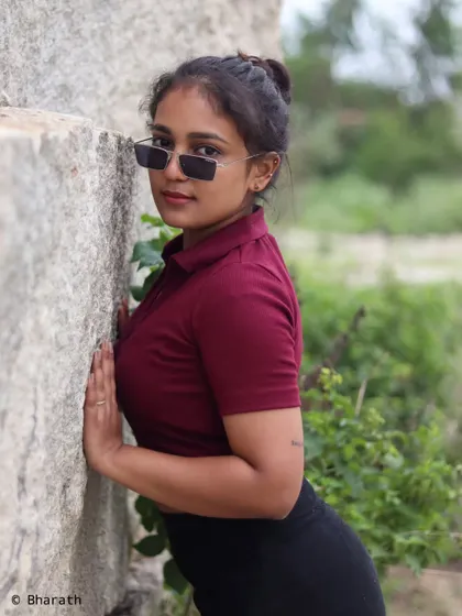 A classic leaning pose against a rock face. This is a simple way to create a dynamic and interesting portrait outdoors.