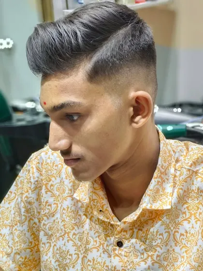 Sharp cut, sharp looks. A classic men's haircut with a high-volume pompadour style.