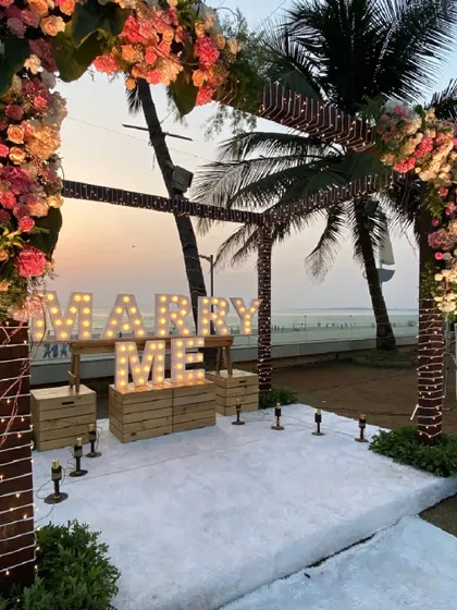 Another view of the sea-facing proposal decor, showing how the palm trees and natural surroundings are incorporated into the magical setting.