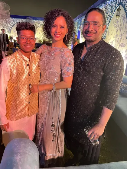 Posing with my core team after a successful destination wedding sangeet. It takes a village to pull off these grand events, and their hard work is the secret behind every magical performance.