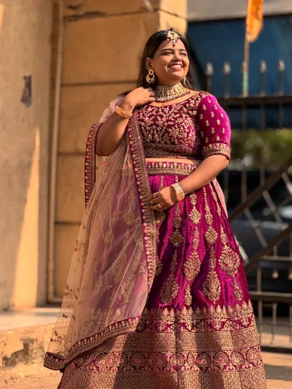 A happy bride-to-be trying out one of my most popular velvet bridal lehengas. The detailed craftsmanship and rich fabric make it a standout piece.