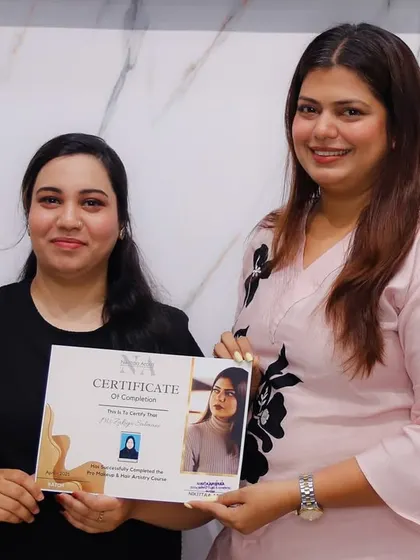 A smile of accomplishment on certification day. This student is now ready to create magic in the real world with her professional skills.