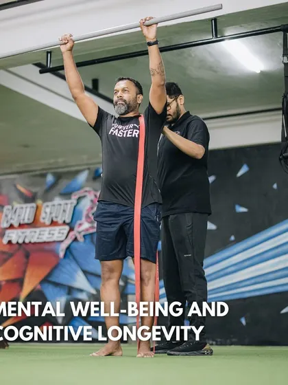 We believe that fitness is about more than just physical appearance; it is about building cognitive longevity and mental well-being. This image shows an adult client working with a coach on a holistic program designed to improve strength, mobility, and posture, which directly contributes to enhanced mental clarity and resilience.