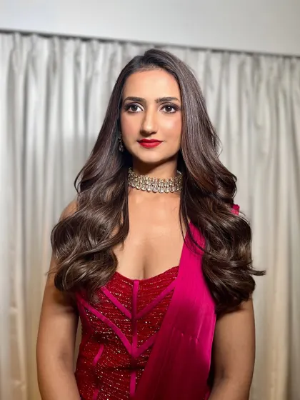 A final shot of this classic glam look. The rich red dress and sparkling choker are perfectly complemented by the sophisticated makeup.