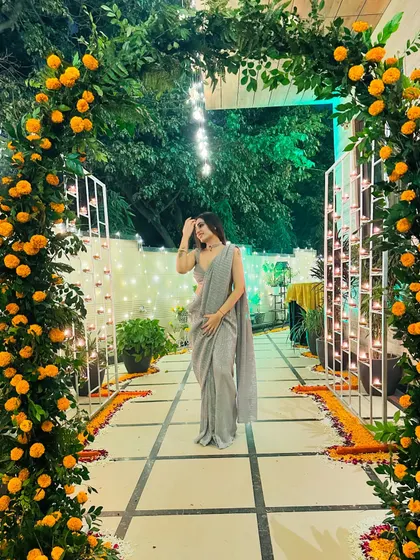 A simple yet elegant grey saree I designed, worn for a festive event. The simplicity of the saree allows the focus to be on the person wearing it.