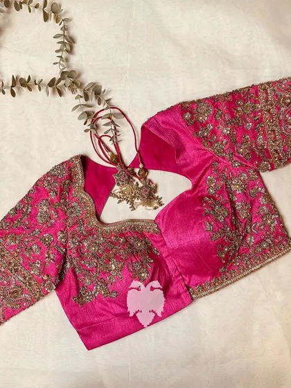 The full view of the pink blouse with its beautiful tassels.
