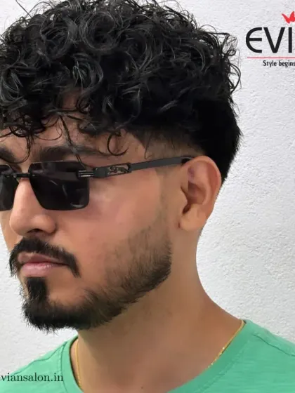 A great haircut is a statement. For this client, I created a modern, stylish look with defined curls on top and a sharp skin fade on the sides. This men's haircut is all about texture, shape, and confidence.