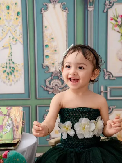 This little girl's happy laugh is infectious. A beautiful, candid moment from a simple, elegant studio session.