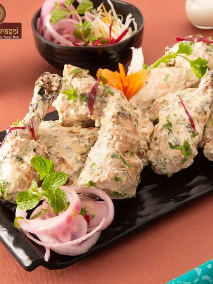 Our creamy Chicken Afghani legs are perfect for a satisfying meal. They are marinated in a rich, mild sauce and cooked until tender and juicy.