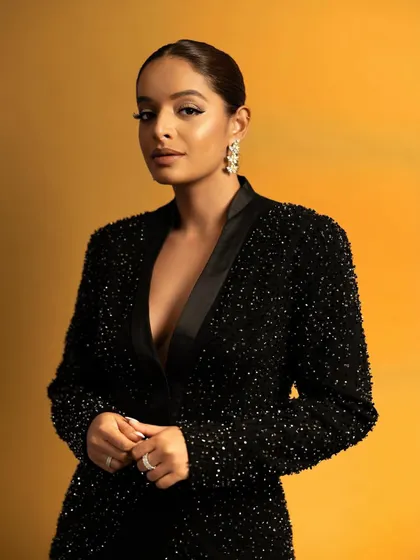 A stunning portrait of Lisa. The slicked-back hair and sharp makeup perfectly complement the high-glamour feel of the sequined blazer dress.