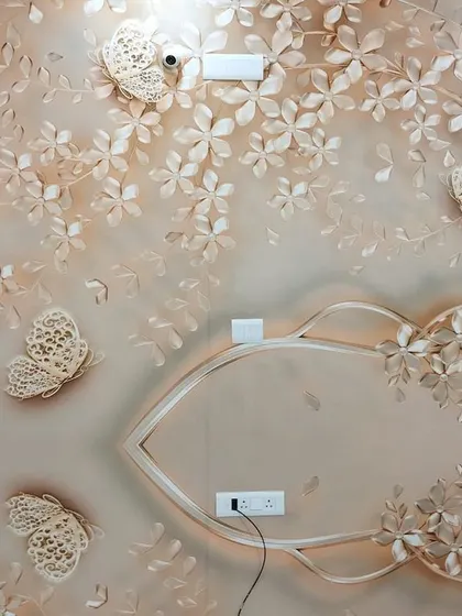 This 3D wallpaper with intricate floral and butterfly cutouts is absolutely stunning. It creates a delicate, layered effect that adds a unique and artistic touch to the wall.