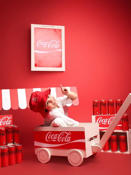 Thinking outside the box with a cool, retro Coca-Cola theme. This shoot shows how we can turn a fun concept into a vibrant and memorable set of portraits, perfect for capturing a child's playful energy.