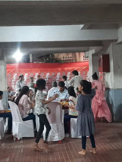 Guests, including children, enjoying the event and food. Creating a comfortable space for all ages is important.