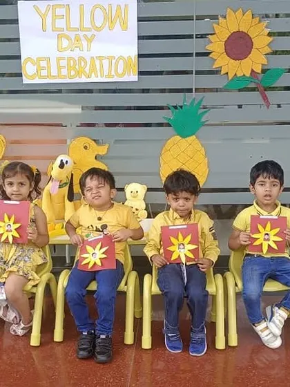 Another group of students with their sun-themed crafts, bringing sunshine into the classroom on Yellow Day.