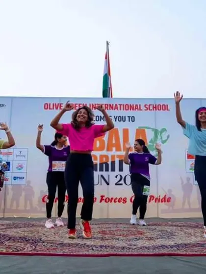 Our team performing on stage at the Ambala Integrity Run, organized by Olive Green International School. We bring coordinated, high-energy dance fitness routines to every event.