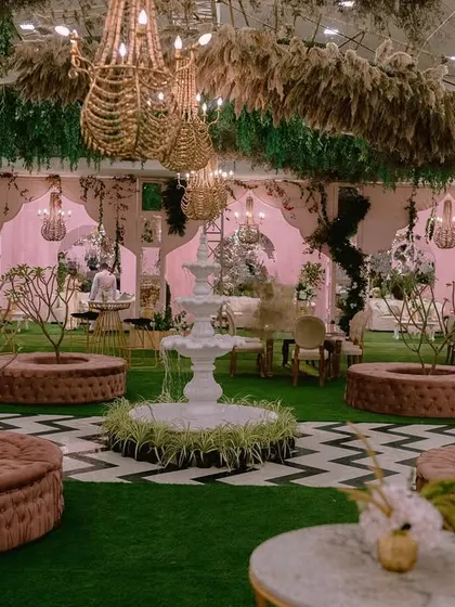 The result of our ballroom transformation for a Mehendi. We created a vibrant indoor garden with a central fountain, chevron-patterned flooring, and cozy seating nooks, proving that any space can become magical.