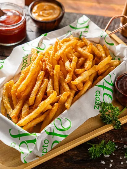 Classic salted french fries for Zepto Cafe. A simple, clean shot that focuses on the product's golden texture, making it an easy and tempting side order for any meal.