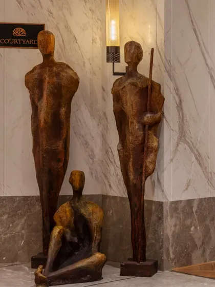 Abstract human-form sculptures crafted from rustic metal, placed strategically within the resort. These art pieces are part of our effort to weave local craftsmanship and regional identity into the guest experience.