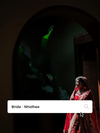 An artistic shot of the bride framed in a doorway, creating a sense of mystery and elegance.