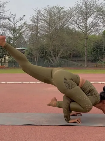 Eka Pada Koundinyasana II is a challenging arm balance that involves a twist. It builds incredible upper body and core strength while also stretching the hamstrings.