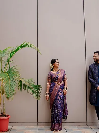 A modern, minimalist portrait of the couple. The clean background and simple composition put all the focus on their happy interaction.