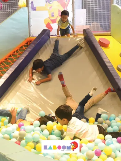 A different angle of our slide and ball pit area, showing kids climbing, sliding, and playing in a dynamic and engaging environment.