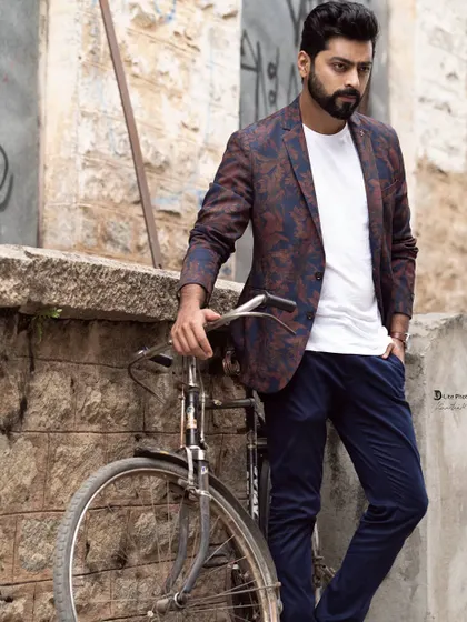 Using a vintage bicycle as a prop for Tarak Ponnappa's shoot. The rustic stone wall and classic prop add a touch of retro charm to this stylish portrait.
