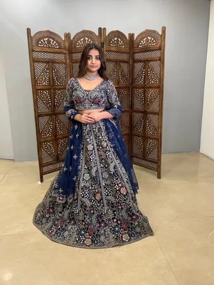 This navy blue lehenga is a perfect example of modern design meeting traditional craftsmanship.