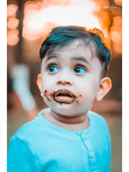 The aftermath of a chocolate cake smash. This close-up of Ivaan captures the innocent, messy fun of being a kid. My goal is to freeze these fleeting, authentic expressions that tell a story.