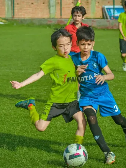 A tough but fair challenge between two determined young players.