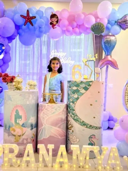 A lovely mermaid-themed setup for a 6th birthday party at home. We used shades of purple and blue, along with seashell and starfish accents, to create an under-the-sea atmosphere.