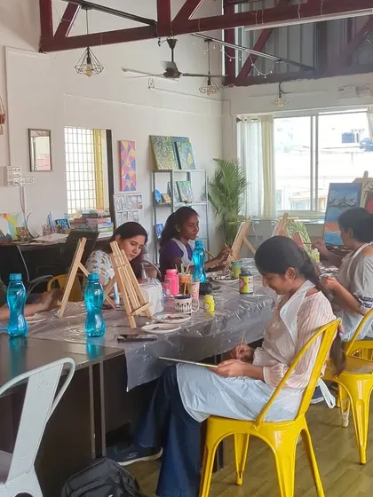 A wide shot of our studio during a busy canvas painting and dot mandala workshop. The atmosphere is always buzzing with creative energy.