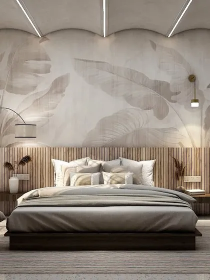 A serene bedroom design featuring a large, nature-inspired mural behind the bed. The low wooden bed, fluted headboard, and soft, indirect lighting from the curved ceiling create a tranquil and organic ambiance.