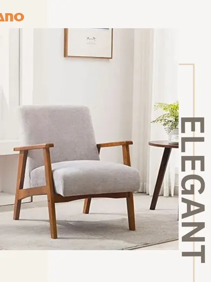 An elegant armchair with a wooden frame and light grey upholstery. This design is a great example of our mid-century modern inspired pieces.