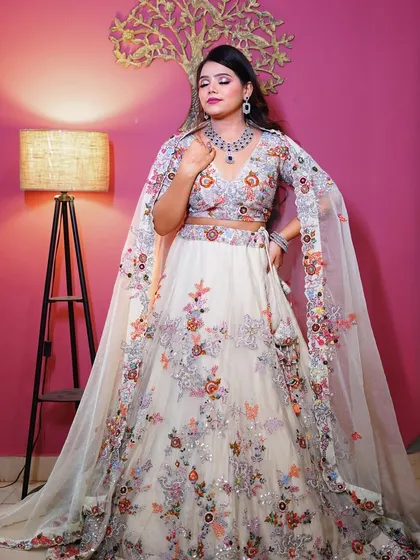A full-length shot of the white floral lehenga, a perfect choice for a day wedding or engagement.