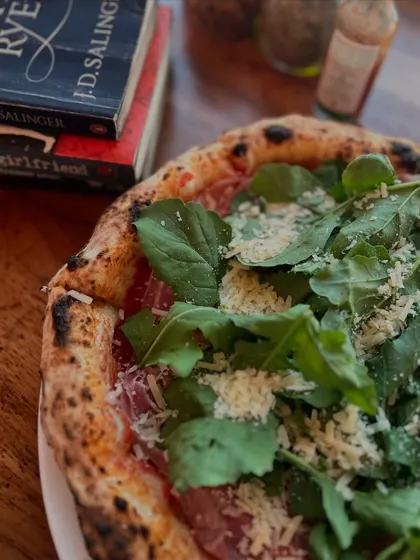 Pizza and a good book. Our Prosciutto di Parma e Rucola is the perfect companion for a quiet day.