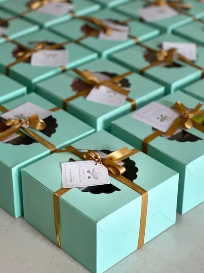Another angle of the beautiful sea-green favor boxes, perfect for a baby boy's naming ceremony.