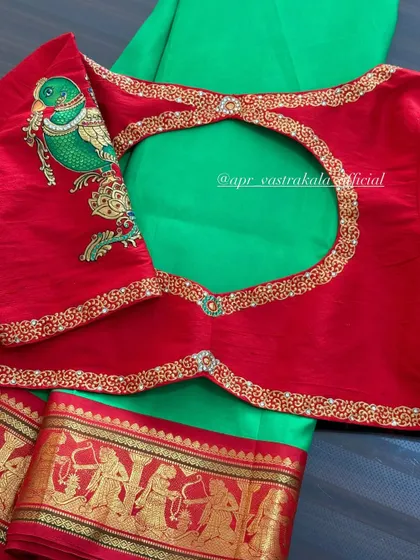 Another view of the red blouse with the painted parrot.