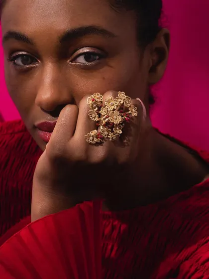 A model wearing the show stopping cherry blossom statement ring. This piece is an extraordinary blend of artistic vision and exceptional craftsmanship, designed to make a lasting impression.
