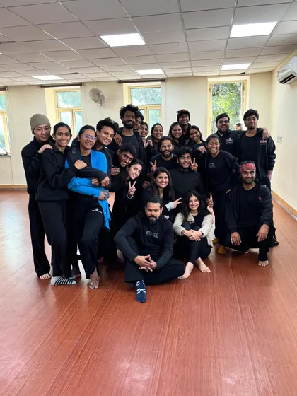 The NSD students and "La Horde" dancers pose for another happy group photo, showing the success of the collaborative workshop.