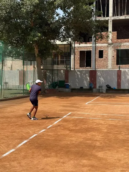 A player hitting a backhand during an AITA U-16 tournament. The concentration and form are what we strive to instill in all our trainees.