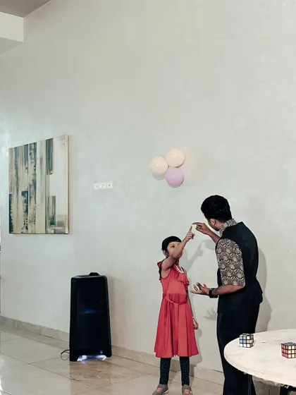 Even the youngest guests can help with the magic. This little one is concentrating hard as she assists with a trick, showing that my show is engaging for all ages.