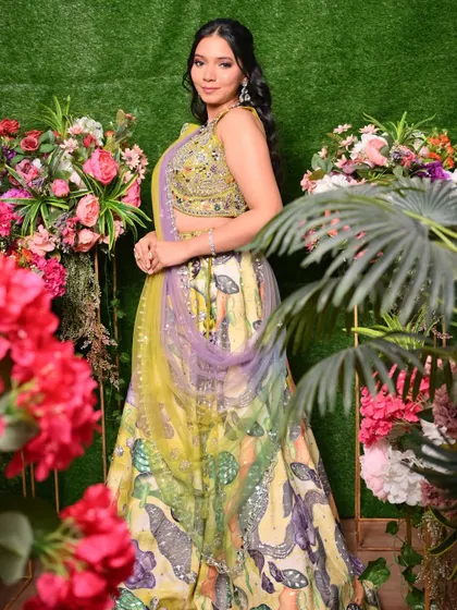 A full-length view of the vibrant Mehendi outfit, showing how the makeup complements the entire ensemble.