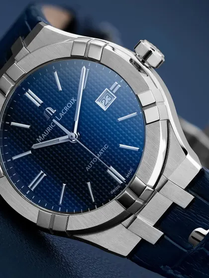 A wider shot of the Maurice Lacroix Aikon, showing how the integrated bracelet and case form a single, seamless design. The focus is on the sharp, architectural lines of the watch.