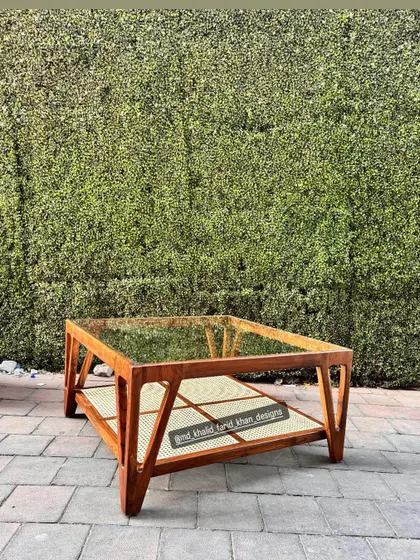 The coffee table is shown next to a matching console, demonstrating a cohesive living room set.