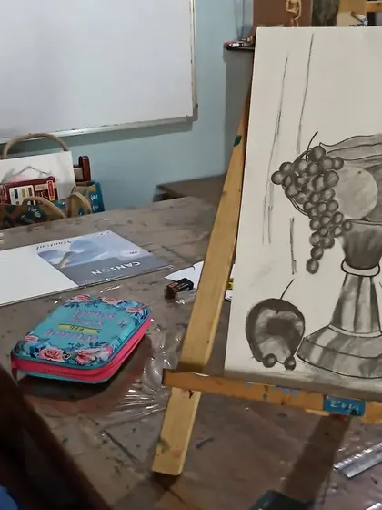 A teen student works on a still life composition, learning the fundamentals of sketching and shading. These skills are the building blocks for all other forms of art.