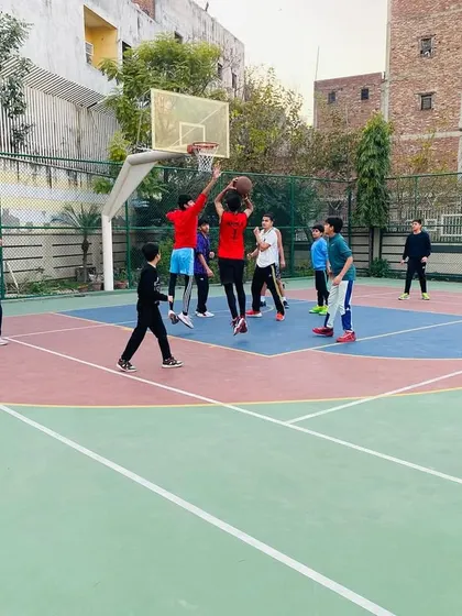 A player goes up for a rebound in the paint. We stress the importance of controlling the boards.