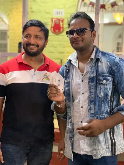 The best magic happens when the audience is part of the trick. Sharing a moment of surprise with a guest after a successful card illusion during a private event for the Collector of Alibag.